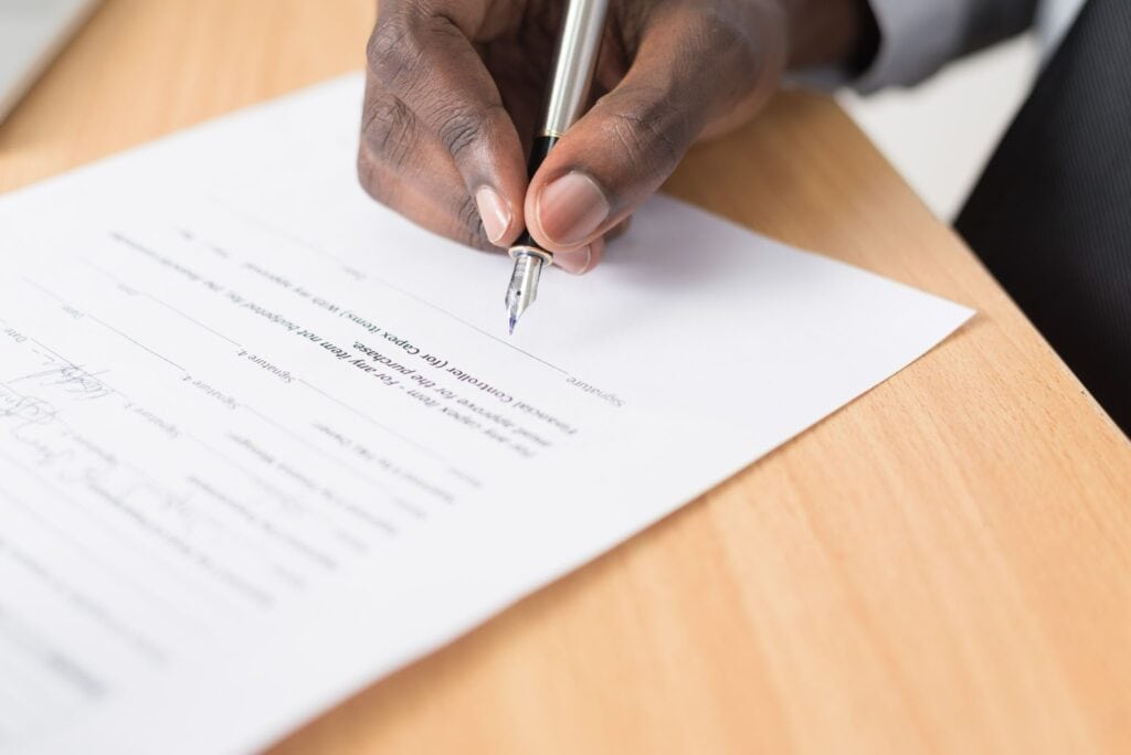 law firm client signing an intake form