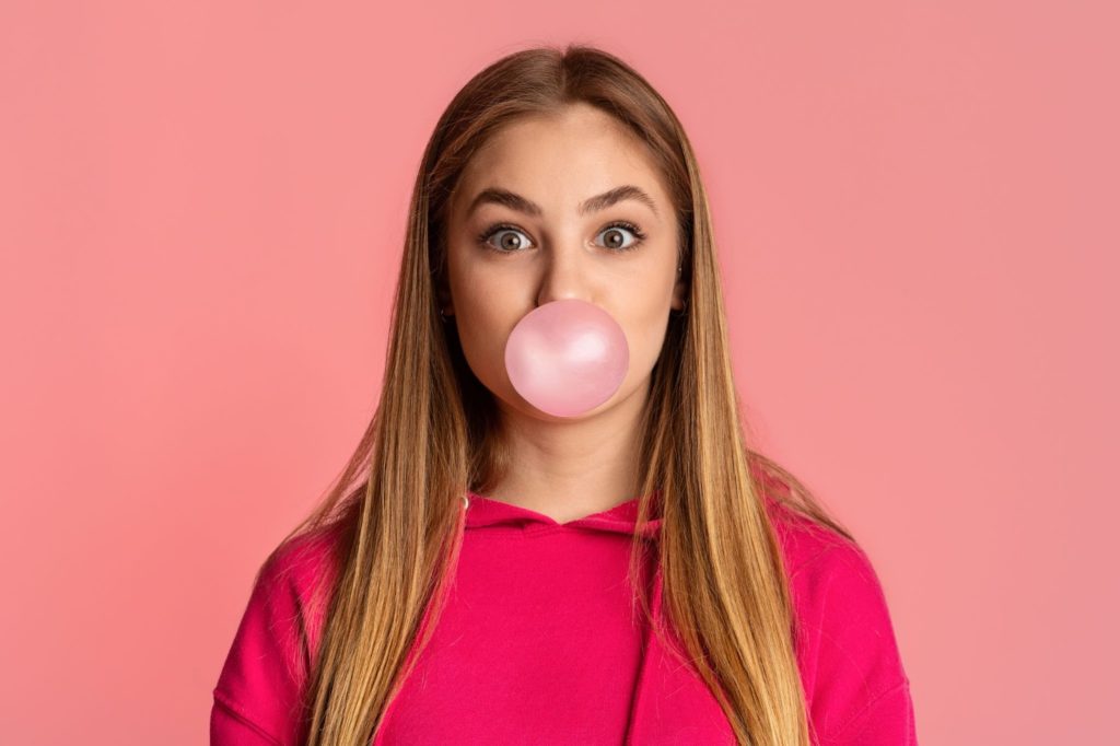 girl eating bubblegum